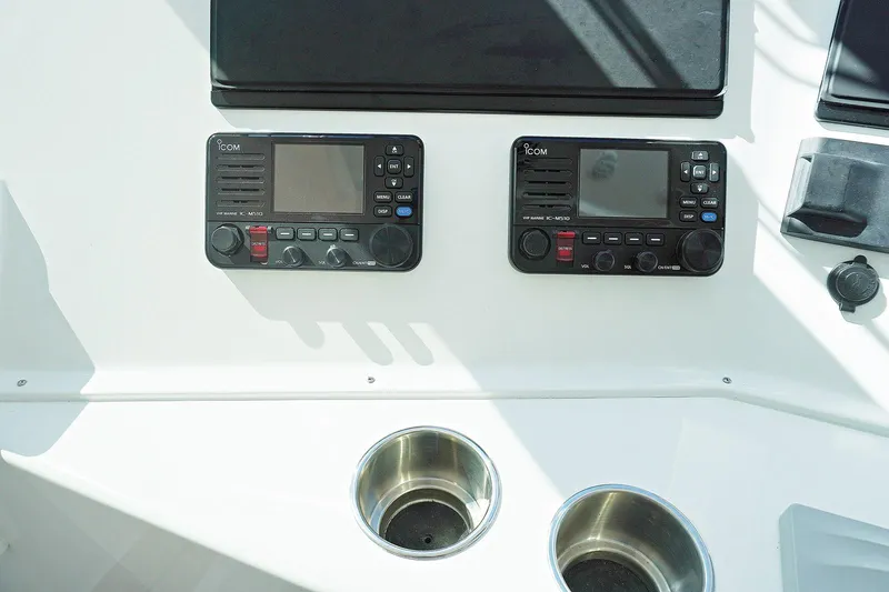 Slide: The Image of Henriques 42EXHT 2022 model dashboard with dual control panels and cup holders. - 45