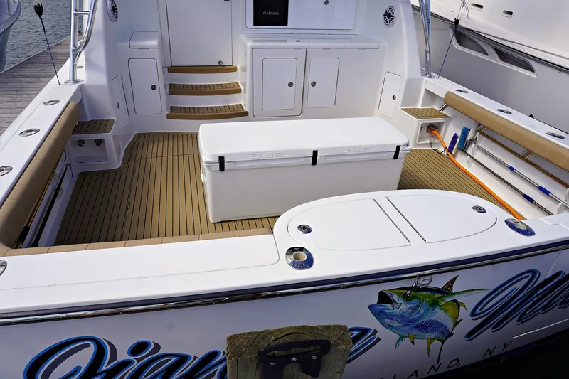 Slide: The Image of Henriques 42EXHT 2022 model boat deck with storage and seating. - 7