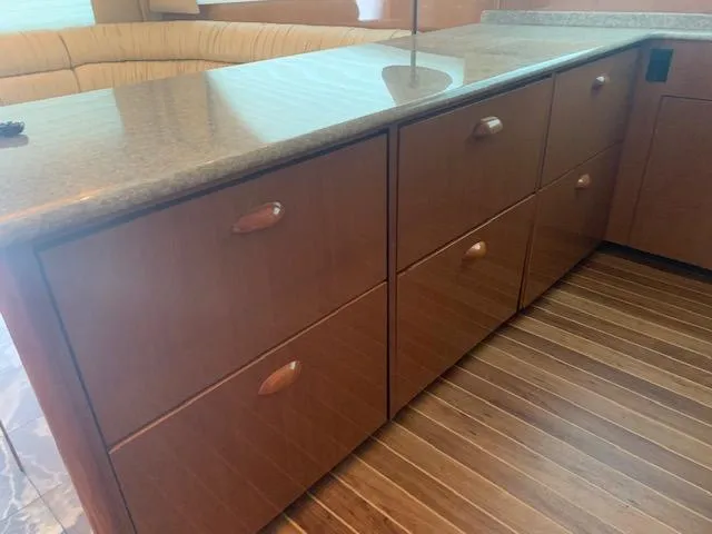 Slide: The Image of Wooden cabinetry and countertop in 2002 Viking 55 Convertible yacht interior. - 17