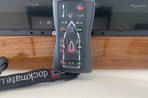 Slide: The Image of Remote control for Viking 55 Convertible 2002 boat, featuring Dockmate system. - 22