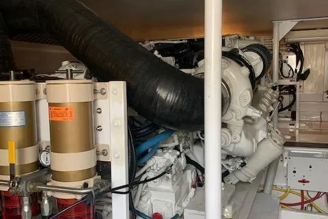 Slide: The Image of Engine room of a 2002 Viking 55 Convertible yacht, showcasing mechanical components. - 38
