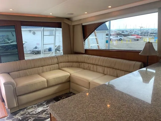 Slide: The Image of Luxurious interior of 2002 Viking 55 Convertible yacht with plush seating and granite countertop. - 44