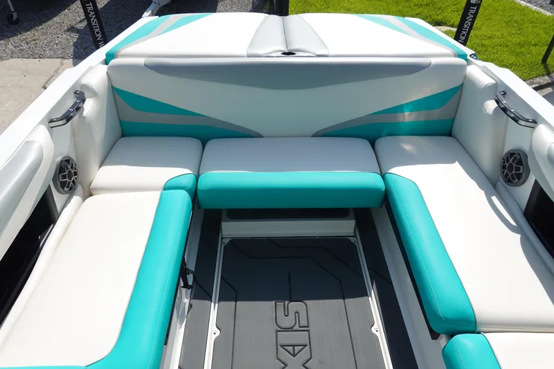 Slide: The Image of 2020 Axis T22 boat interior with teal and white seating. - 12