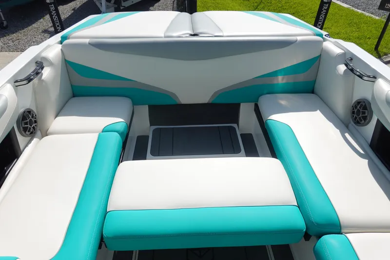 Slide: The Image of 2020 Axis T22 boat interior with teal and white seating. - 15