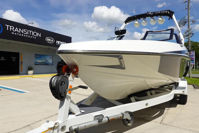 Slide: The Image of 2020 Axis T22 boat on trailer at Transition Watersports dealership. - 2