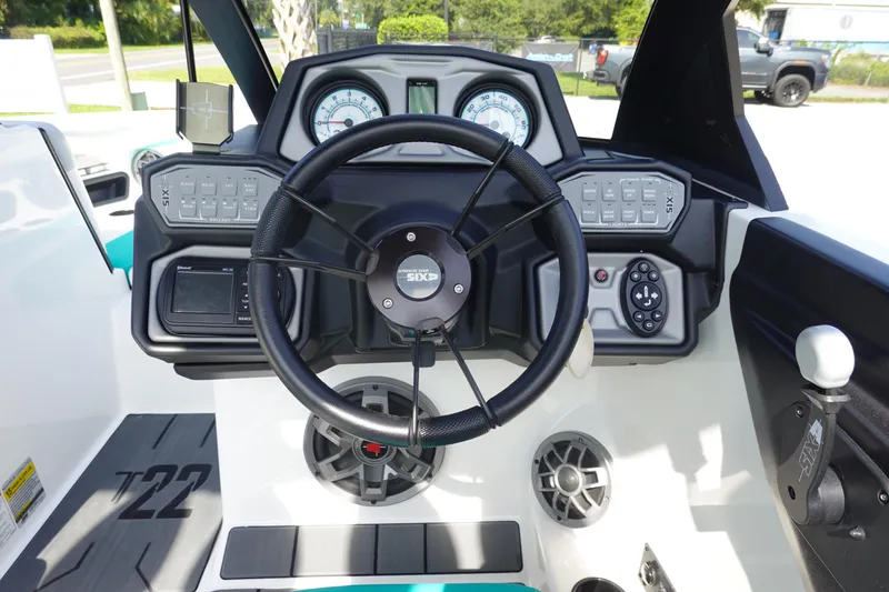 Slide: The Image of 2020 Axis T22 boat dashboard with steering wheel and control panel. - 23