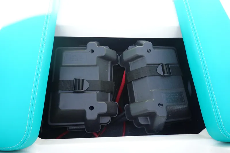 Slide: The Image of Two secured battery boxes in a 2020 Axis T22 boat compartment. - 32