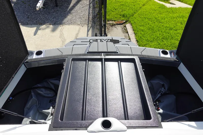 Slide: The Image of Axis T22 2020 boat storage compartment with open hatches, showing interior space. - 40