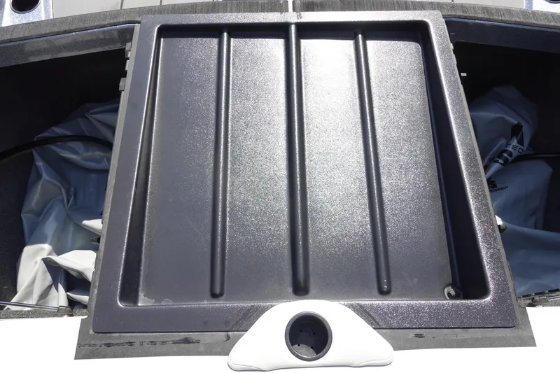 Slide: The Image of Axis T22 2020 boat storage compartment with black lid and white handle. - 42