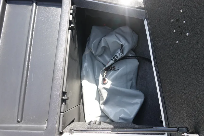Slide: The Image of Storage compartment of 2020 Axis T22 boat with folded cover inside. - 43