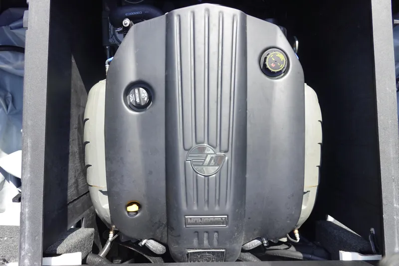 Slide: The Image of 2020 Axis T22 engine compartment with protective cover and visible components. - 44