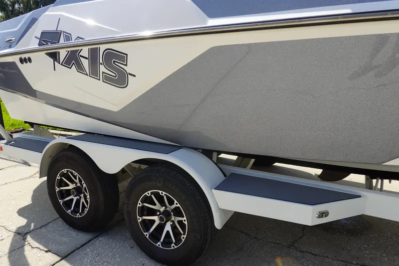 Slide: The Image of 2020 Axis T22 boat on trailer with stylish wheels and sleek design. - 45