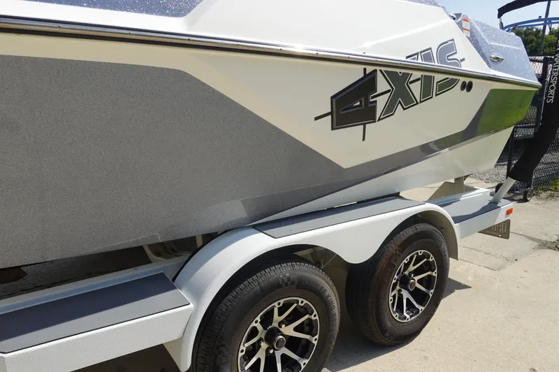 Slide: The Image of 2020 Axis T22 boat on trailer, featuring sleek design and modern graphics. - 47