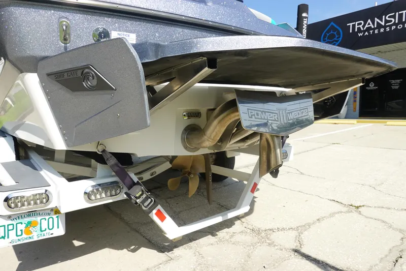 Slide: The Image of Axis T22 2020 boat rear view with propeller and license plate, displayed at Transition Watersports. - 8