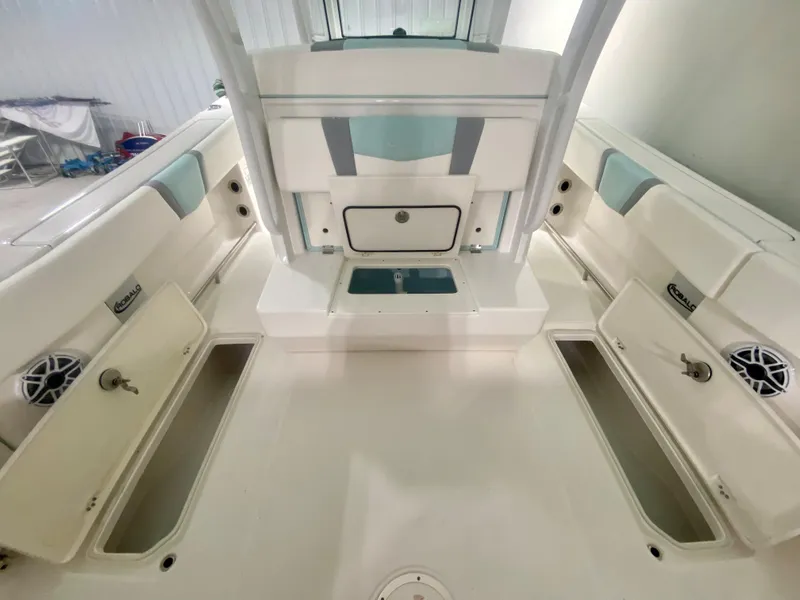 Slide: The Image of 2024 Robalo R270 boat interior with storage compartments and seating. - 12