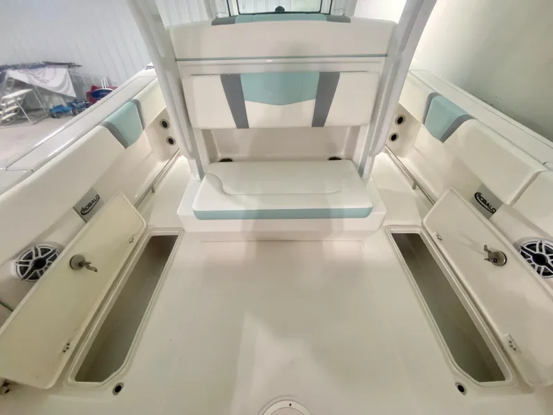 Slide: The Image of 2024 Robalo R270 boat interior with storage compartments and seating. - 13