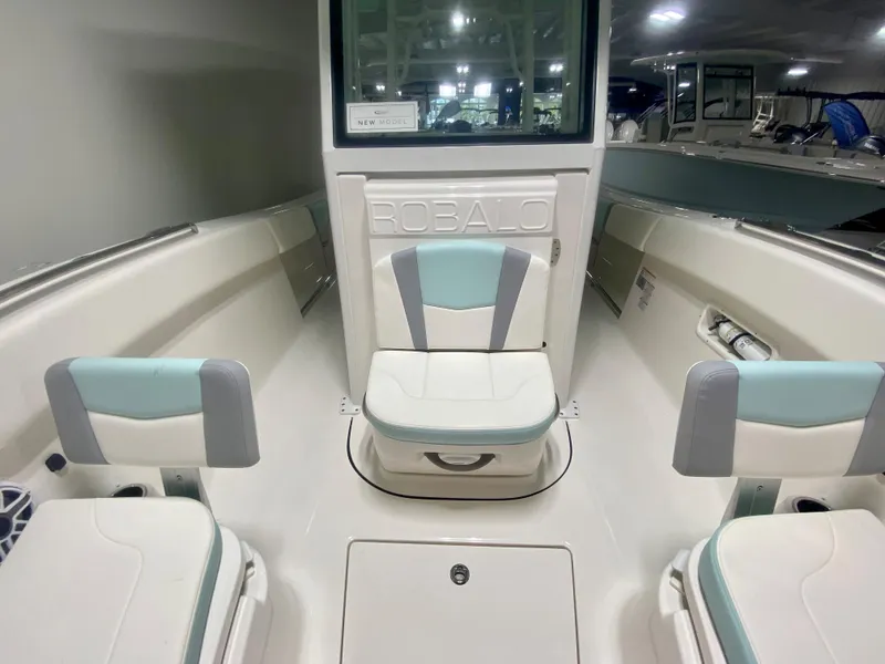 Slide: The Image of 2024 Robalo R270 boat interior with seating and storage compartments. - 25