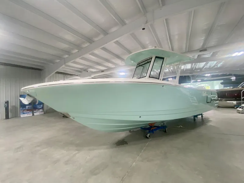 Slide: The Image of 2024 Robalo R270 boat in indoor showroom. - 4
