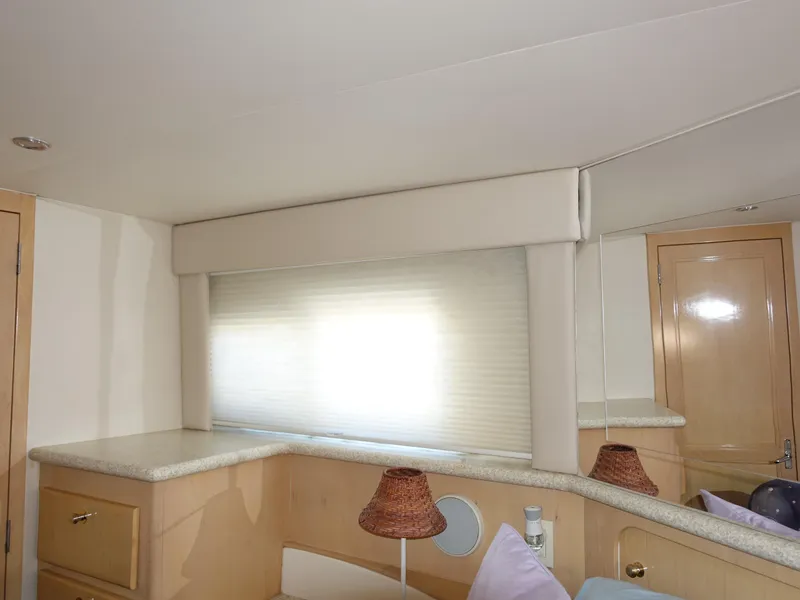 Slide: The Image of Interior of 2000 Carver 406 Aft Cabin Motor Yacht with window and cabinets. - 27