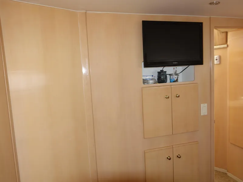 Slide: The Image of Interior of 2000 Carver 406 Aft Cabin Motor Yacht with TV and cabinets. - 28