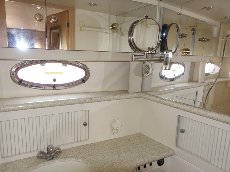 Slide: The Image of Luxurious bathroom in 2000 Carver 406 Aft Cabin Motor Yacht with mirrored cabinets. - 31