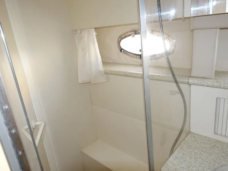 Slide: The Image of Bathroom interior of 2000 Carver 406 Aft Cabin Motor Yacht with shower and window. - 35