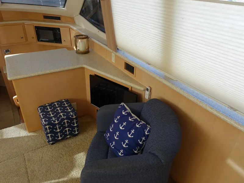 Slide: The Image of Interior of 2000 Carver 406 Aft Cabin Motor Yacht with nautical-themed decor. - 4
