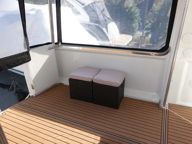 Slide: The Image of Carver 406 Aft Cabin Motor Yacht 2000, teak deck with cushioned seating. - 41