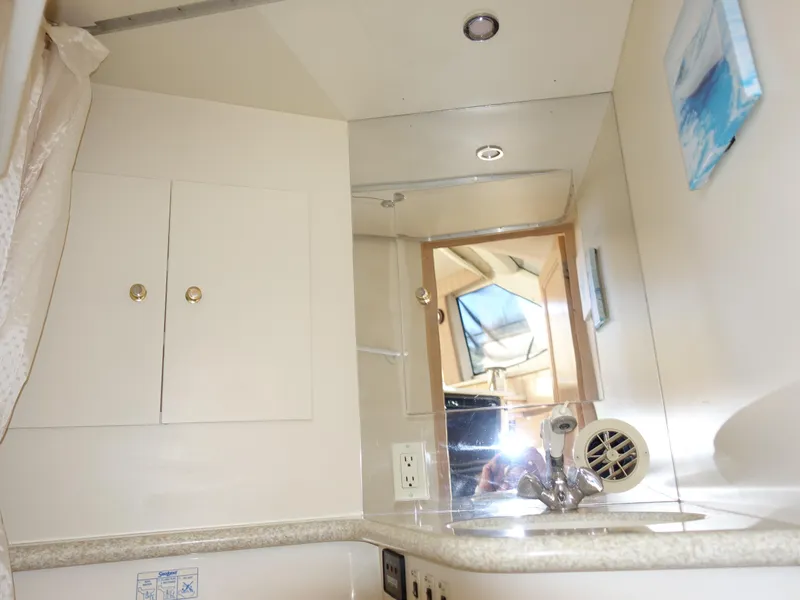 Slide: The Image of Interior of 2000 Carver 406 Aft Cabin Motor Yacht bathroom with sink and mirror. - 20