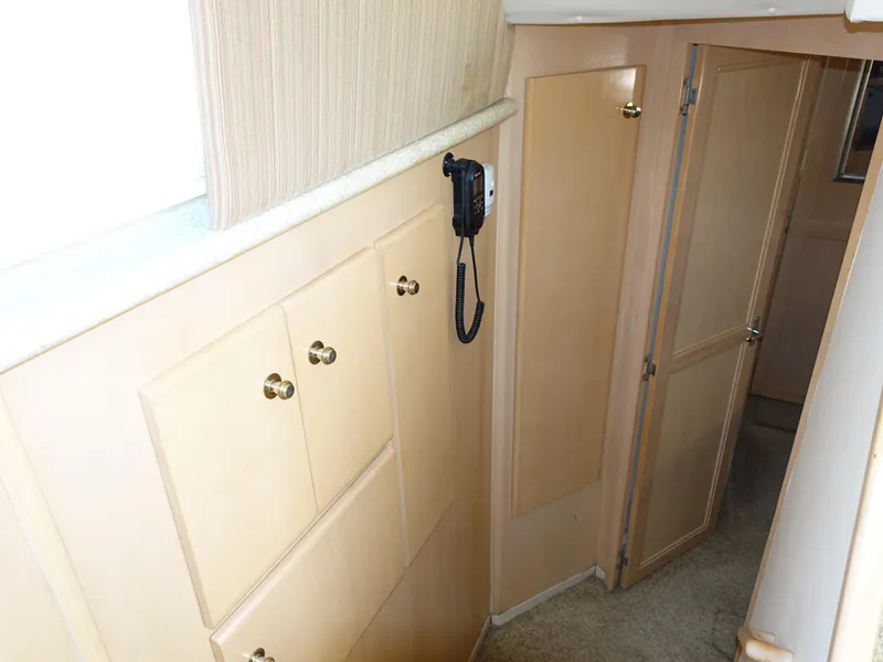 Slide: The Image of Interior hallway of 2000 Carver 406 Aft Cabin Motor Yacht with wood cabinets. - 25
