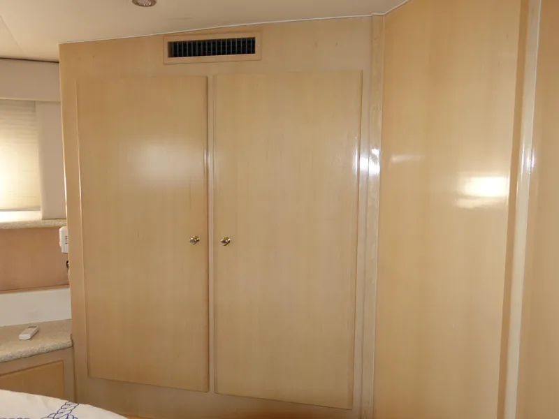 Slide: The Image of Interior of 2000 Carver 406 Aft Cabin Motor Yacht with wooden cabinetry. - 29