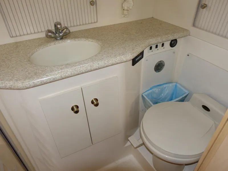 Slide: The Image of Bathroom interior of 2000 Carver 406 Aft Cabin Motor Yacht with sink and toilet. - 32