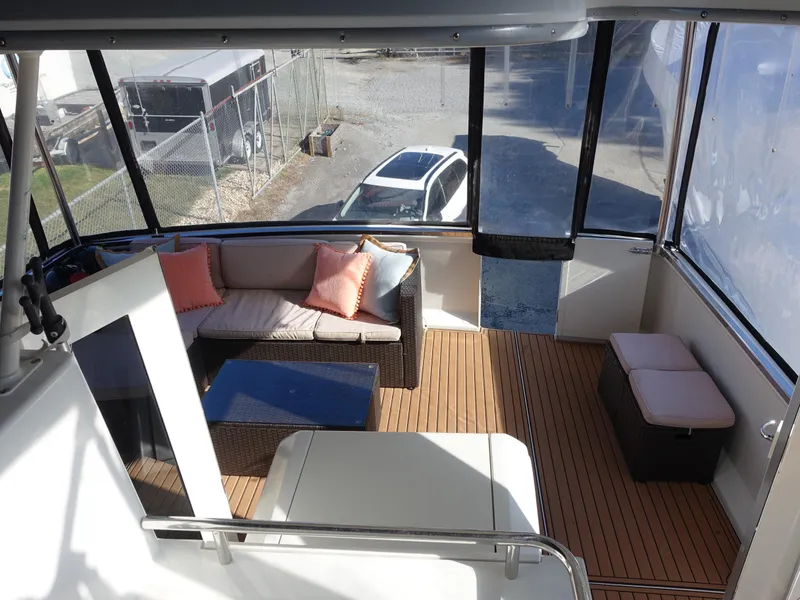 Slide: The Image of Interior of 2000 Carver 406 Aft Cabin Motor Yacht with seating and wood flooring. - 40