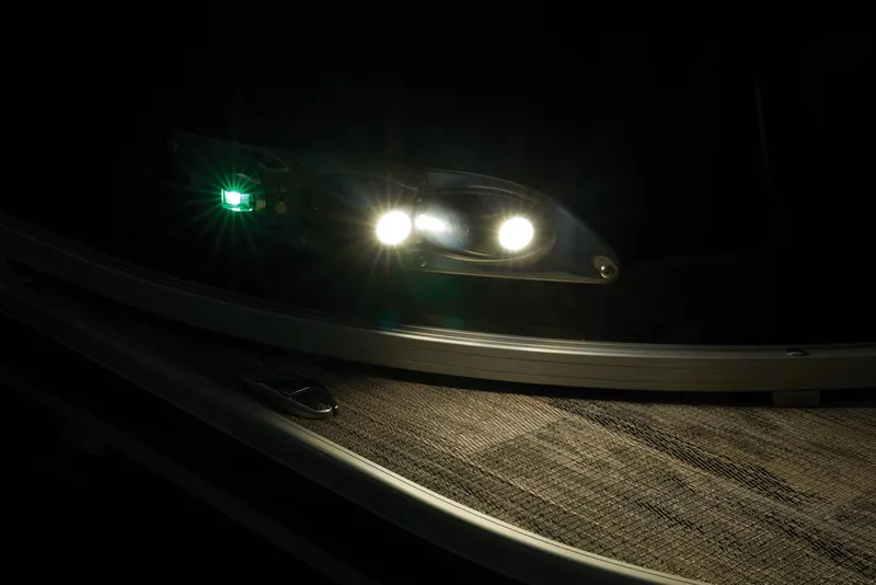 Slide: The Image of 2024 Ranger Reata 220C boat navigation lights in the dark. - 12