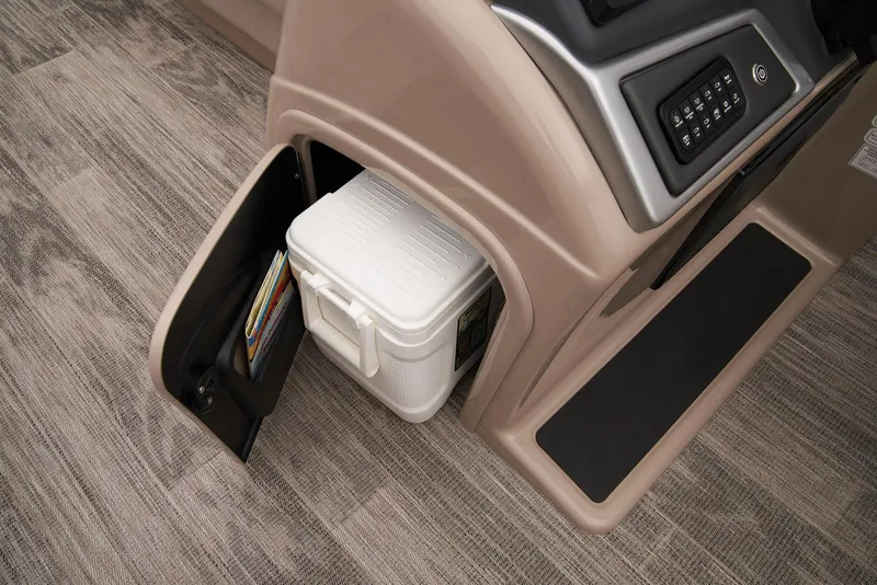 Slide: The Image of 2024 Ranger Reata 220C storage compartment with cooler and control panel. - 23