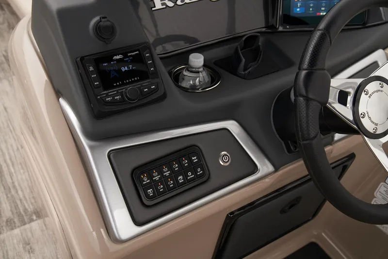 Slide: The Image of 2024 Ranger Reata 220C dashboard with controls and steering wheel. - 32