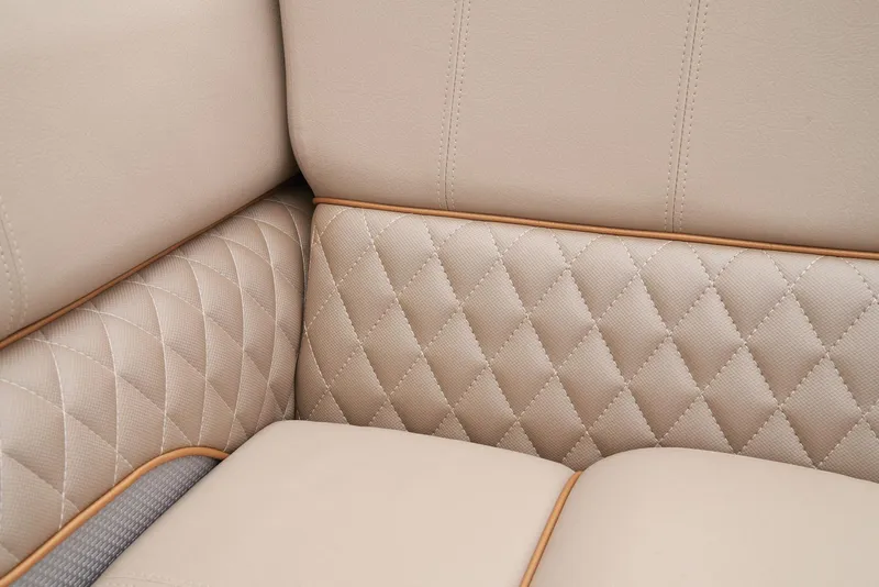 Slide: The Image of 2024 Ranger Reata 220C beige quilted leather interior detail. - 42