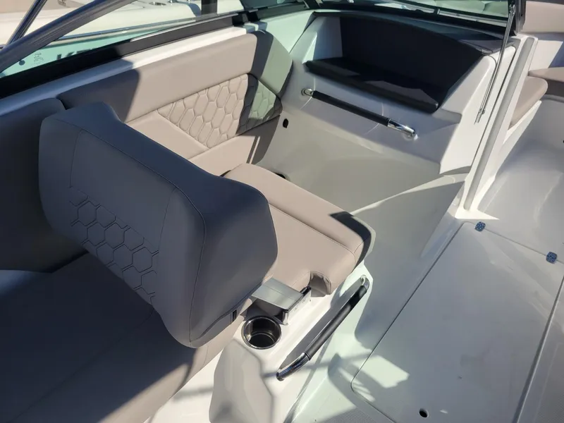 Slide: The Image of 2024 Four Winns H1 OB boat interior with gray seating and modern design. - 20