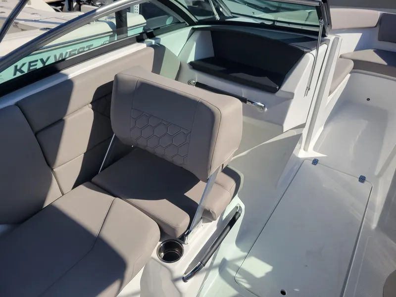 Slide: The Image of 2024 Four Winns H1 OB boat interior with gray seating and modern design. - 21