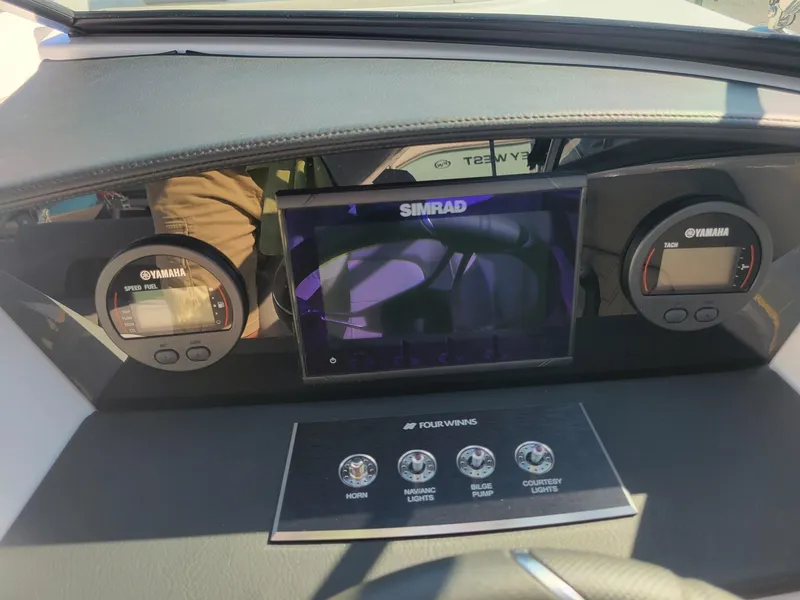 Slide: The Image of Dashboard of 2024 Four Winns H1 OB boat with Simrad display and Yamaha gauges. - 25