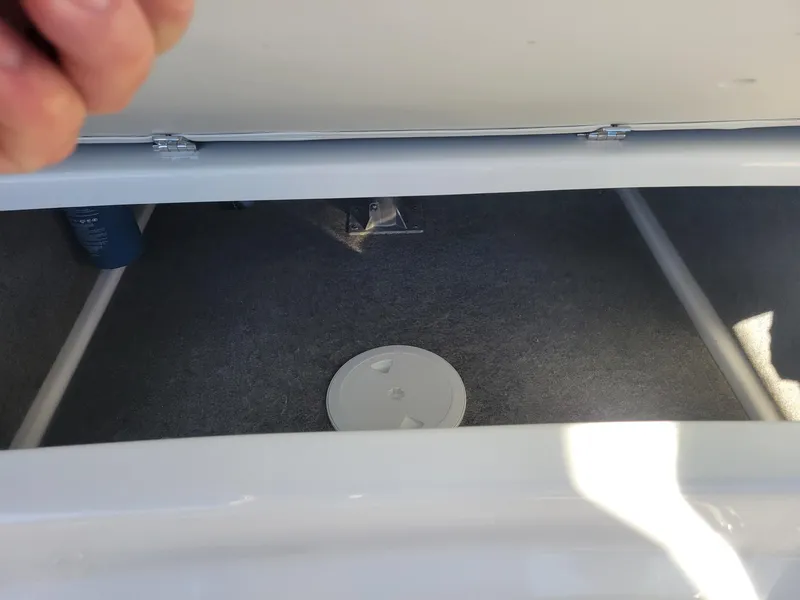 Slide: The Image of Storage compartment of 2024 Four Winns H1 OB boat. - 31