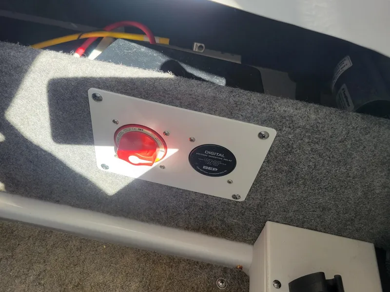 Slide: The Image of Control panel of 2024 Four Winns H1 OB boat with red switch and digital gauge. - 32