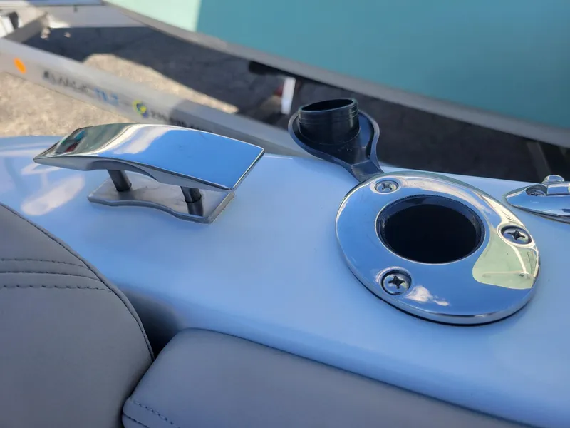 Slide: The Image of 2024 Four Winns H1 OB boat cleat and rod holder on deck. - 40
