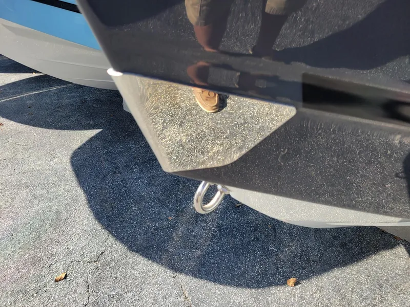 Slide: The Image of 2024 Four Winns H1 OB boat detail showing hull and metal ring. - 6