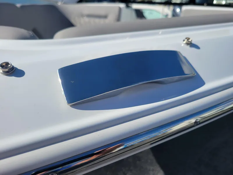 Slide: The Image of 2024 Four Winns H1 OB boat, close-up of sleek chrome detail. - 7