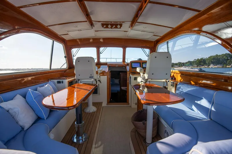 Slide: The Image of Hinckley Talaria 40 helm with dual navigation screens and classic wooden steering wheel, 2005 model. - 10