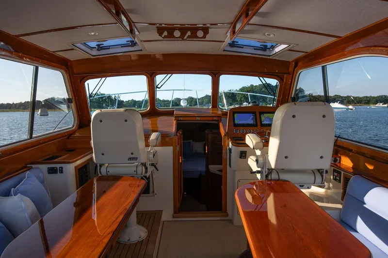 Slide: The Image of Luxurious interior of 2005 Hinckley Talaria 40 yacht with leather seating and wooden finishes. - 13