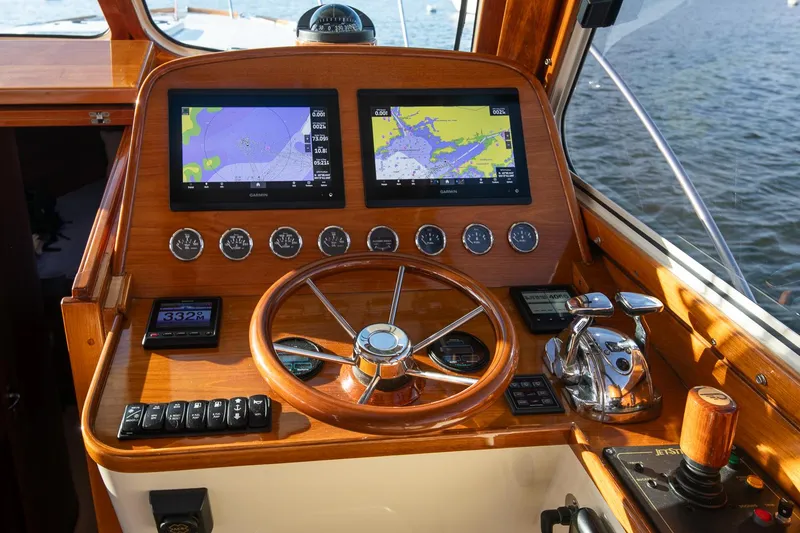Slide: The Image of Interior of 2005 Hinckley Talaria 40 yacht with luxurious seating and wooden accents. - 14