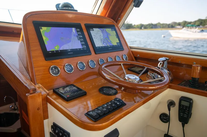 Slide: The Image of Interior of 2005 Hinckley Talaria 40 yacht with polished wood and navigation equipment. - 15
