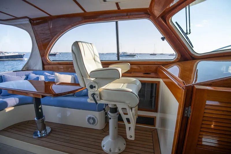 Slide: The Image of Hinckley Talaria 40 yacht deck with seating, American flag, ocean view, 2005 model. - 18